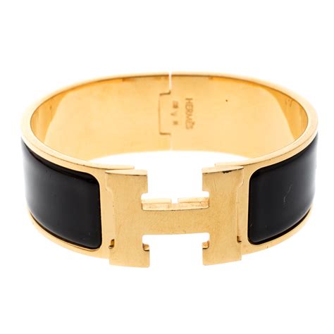 hermes black and gold bracelet.